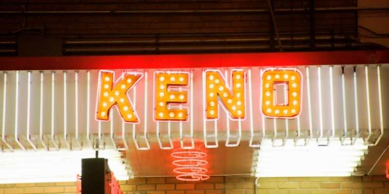 a neon sign with a word keno