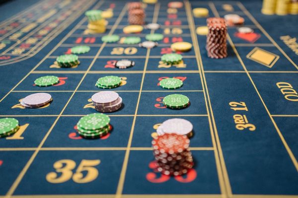 baccarat table with chips stacked on top