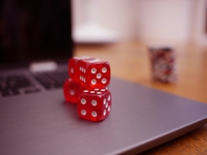 red stacked dice on silver laptop